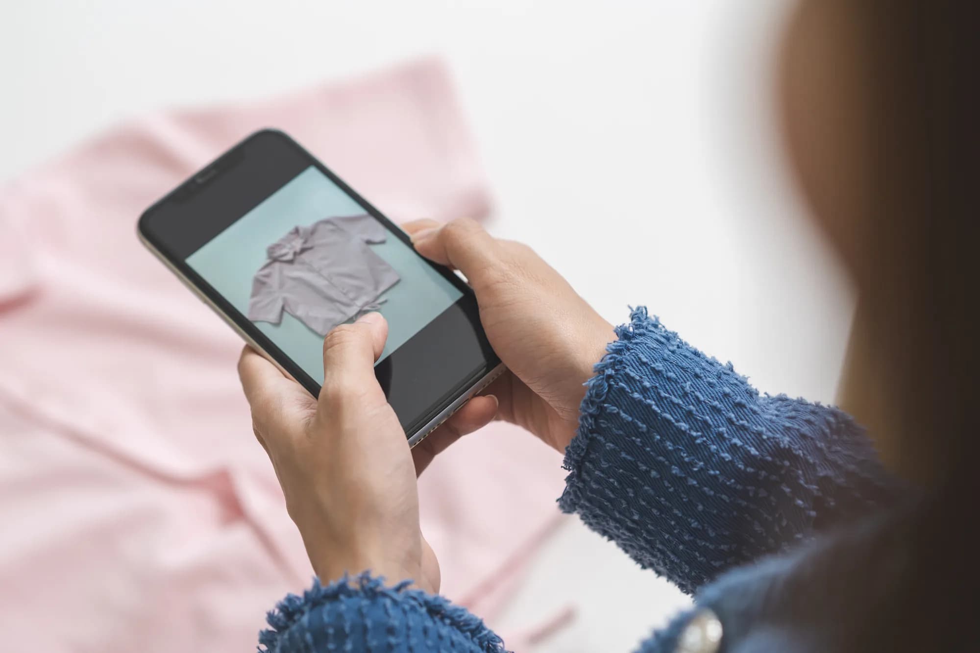 A small business owner photographing a product with a smartphone