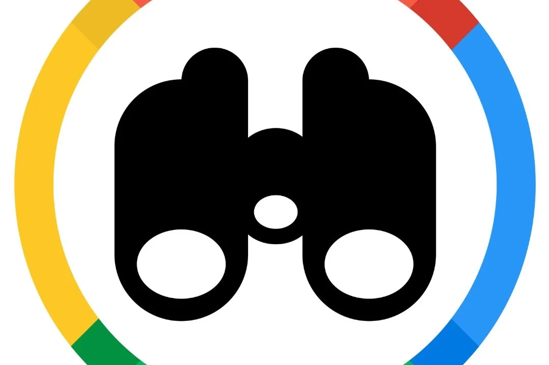 Illustration of a circle with the Google logo colors and a pair of binoculars in the center