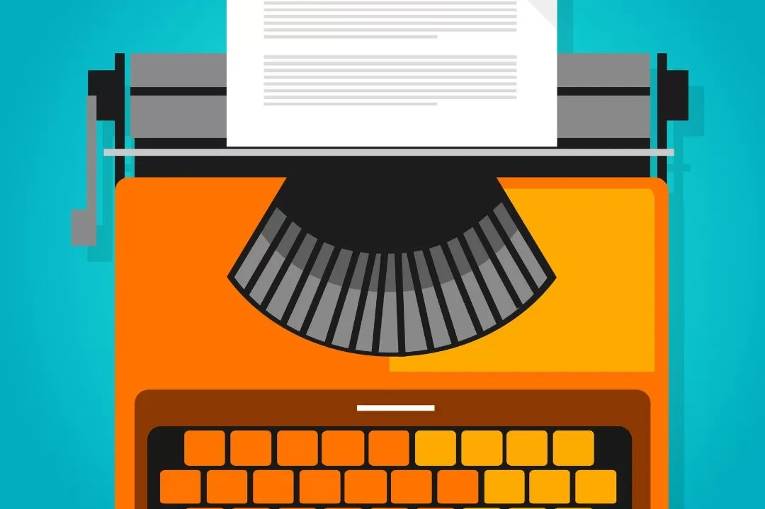 Image of an orange typewriter with a paper titled Press Release" on the top