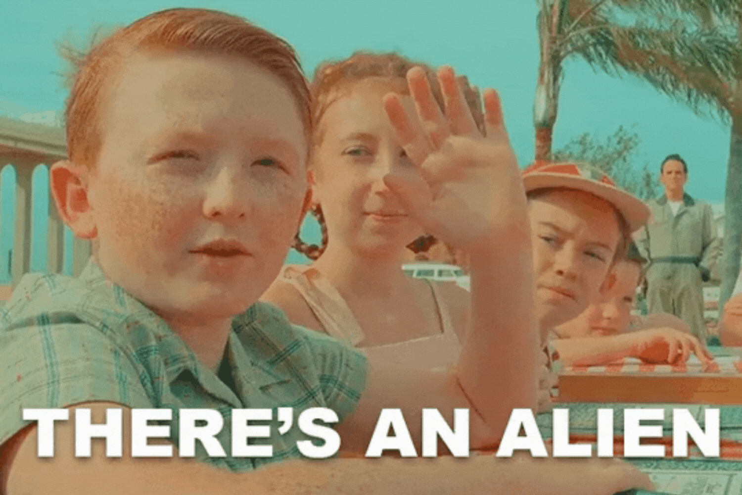 A GIF of the Asteroid City movie's Reddit free-form ad campaign with three child actors talking about aliens